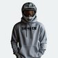 Grauer SENDER ENERGY Hoodie, getragen von einem Downhill-Biker mit Helm, ideal für Extremsportler und Lifestyle-Fans